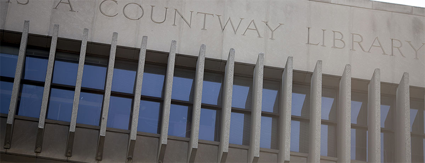Photo of the roof line of the Countway Library of Medicine with the words "Countway Library" carved into the stone