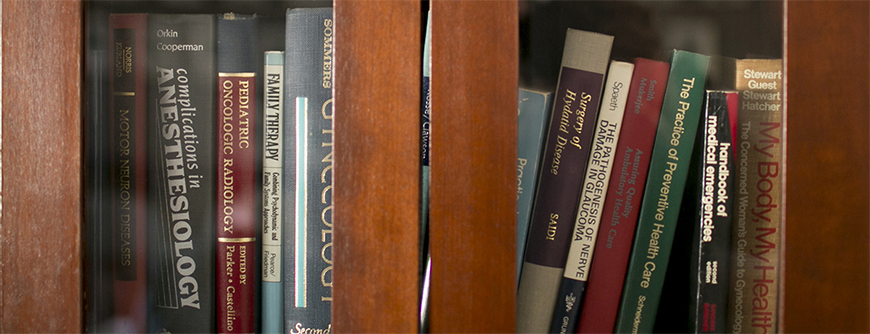 Photo of books lined up on a bookshelf