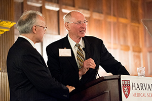 Photo of two men at a podium