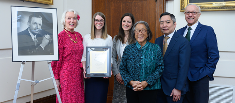A framed photo of Hollis L. Albright is seen at left, beside Tenley E. Albright. The participants in the 2025 Hollis L. Albright, MD '31 Symposium include 2025 Albright Scholar recipient Marta Williams, 2010 Albright Scholar recipient Regan W. Bergmark, Arky Family Associate Director and Advisor of the Francis Weld Peabody Society Beverly Woo, HMS Dean for Medical Education Bernard Chang, and HMS Dean George Daley. Image: Gretchen Ertl