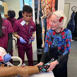 Albright visiting with students participating in the HMS MEDscience Program.