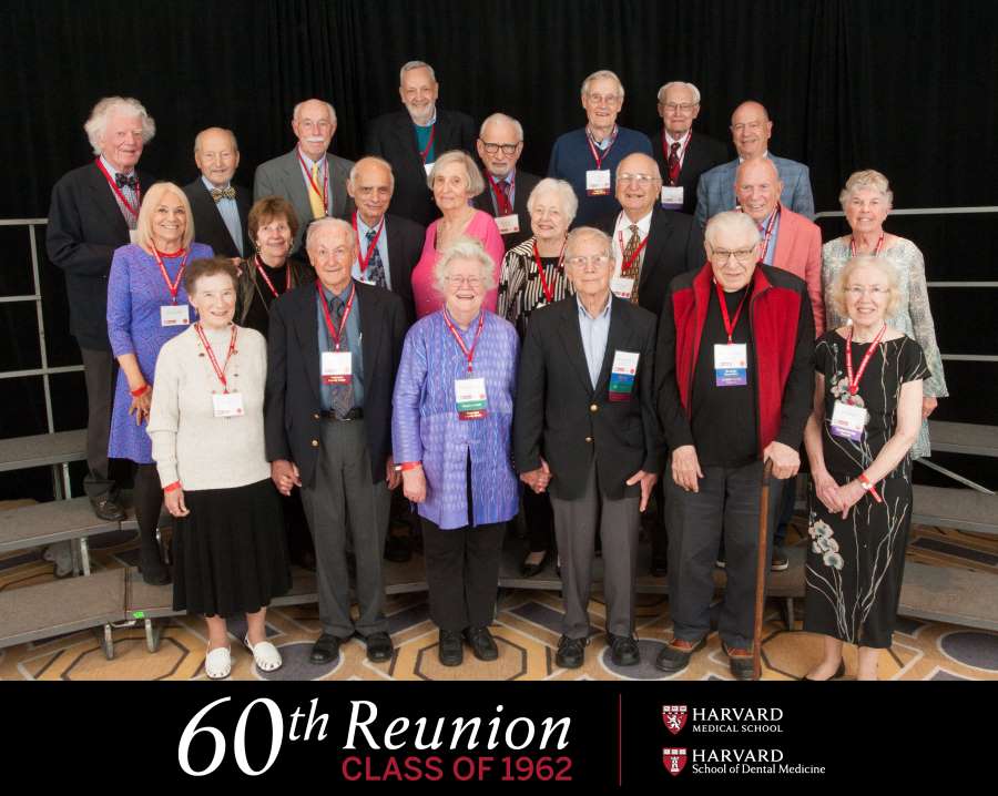 Members of the class of 1962 smiling for a class photo 