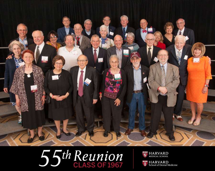 Members of the class of 1967 smiling for a class photo 