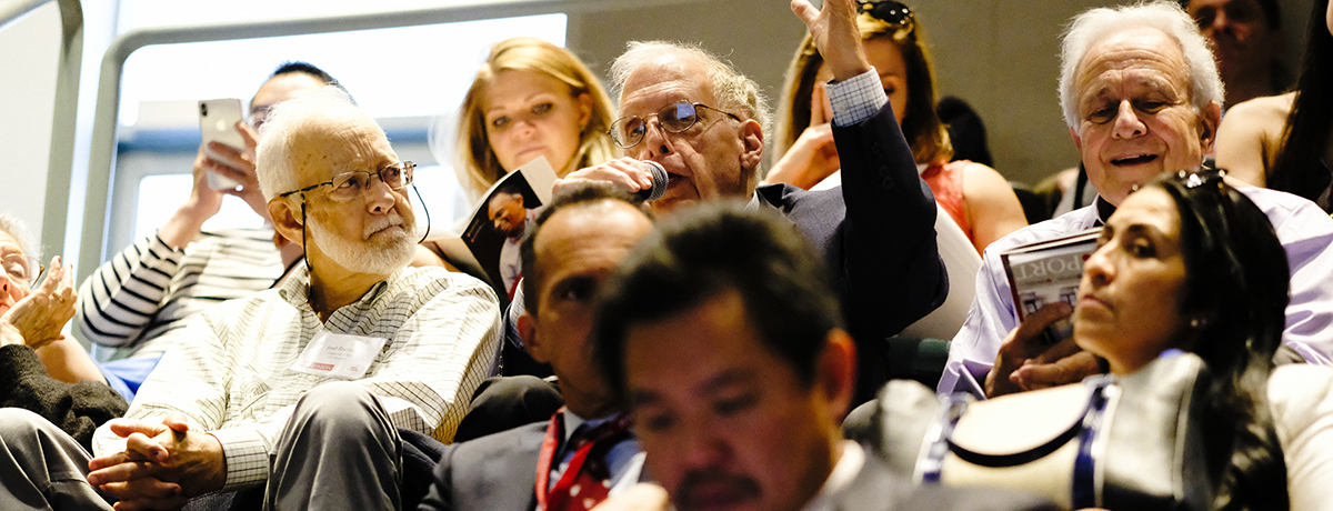 Photo of crowd listening to a symposia